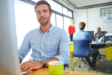 Aufkleber - Theres no substitute for hard work. Portrait of a designer at work on a computer in an office.