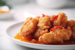 Sweet and sour chicken Sticky sweet and sour sau on a white plate, ai generation