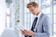 © J Bergen/peopleimages.com - He has a drive for business. A young businessman standing in the workplace.