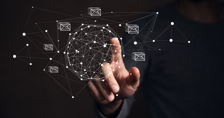 Poster - Businessman hand pressing smartphone for sending the e-mail from the laptop computer, Email and SMS