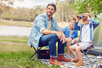 Poster - Its guy time. a father and his two sons out camping in the woods.