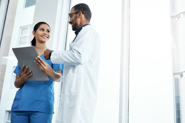 Canvas Print - This patient has shown great progress. two young doctors using a digital tablet in a modern hospital.