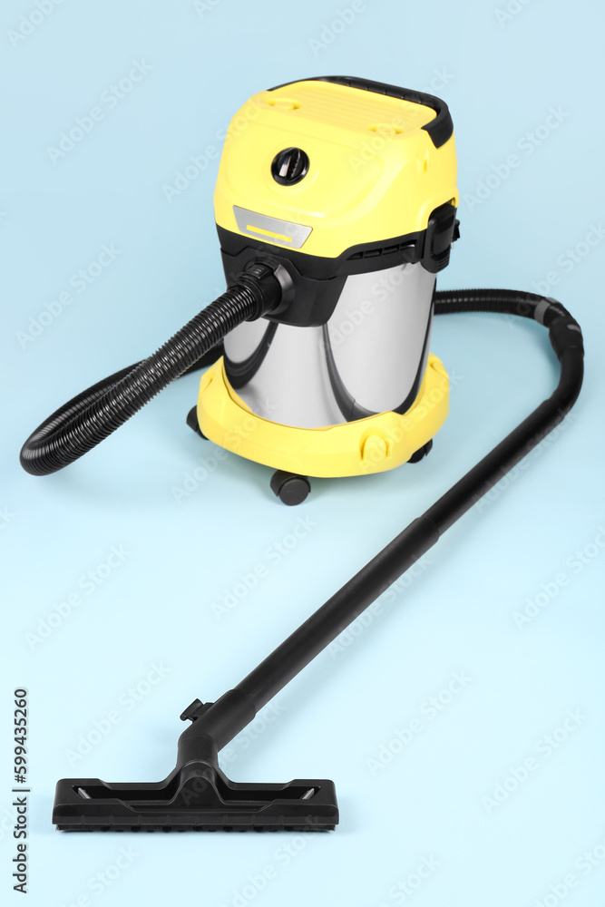 Vacuum cleaner on blue background