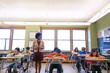 © GR/peopleimages.com - Assessment is a critical piece of the learning process. a teacher in a classroom with her students.