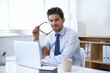 © Mariusz/peopleimages.com - I meet my deadlines. Portrait of a handsome young businessman sitting at his desk.