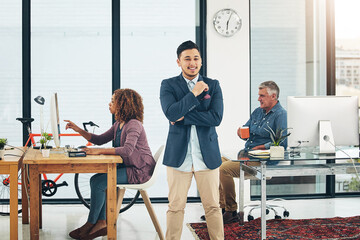Leinwandbilder - My career is right on track. Portrait of a confident young creative posing in front of his colleagues in the office.