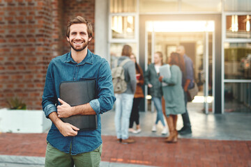 Aufkleber - Im here for the knowledge. Portrait of a happy young man standing outdoors on campus.