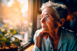 © graja - Serious older woman looks out window spend time alone at home, feels sad or disappointed, waits or misses someone. AI generated