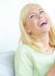 © Grady R/peopleimages.com - Having a good laugh. An attractive young woman laughing and smiling while looking away.