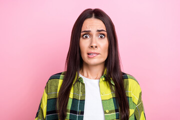 Sticker - Photo of impressed unsure lady wear checkered jacket biting lip big eyes isolated pink color background