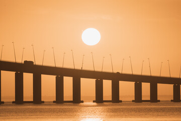 silhouette of a sea ​​bridge, Vasco da Gama bridge at sunrise