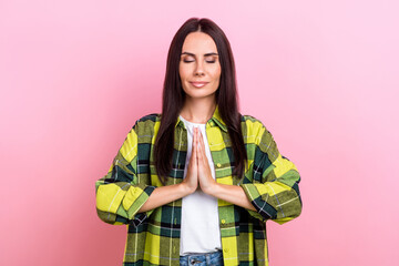 Sticker - Portrait of gorgeous positive girl closed eyes arms palms meditate pray isolated on pink color background