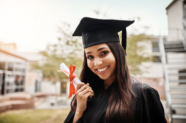 Poster - Proud to be graduating. Portrait of a female student on graduation day from university.