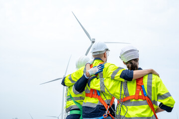 Wall Mural - Electrical engineer checking on wind turbine energy production,Concept of alternative energy and service.