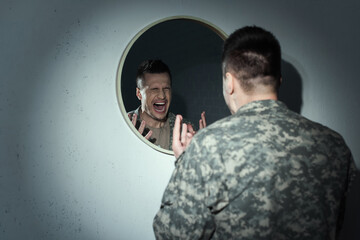 Poster - Angry military veteran screaming near mirror while suffering post traumatic stress disorder.