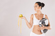 © C.D./peopleimages.com - Fitness, health and woman with scale and apple for weightloss, diet and nutrition on white studio background. Exercise, wellness and girl with fruit, balance and measuring tape for healthy lifestyle