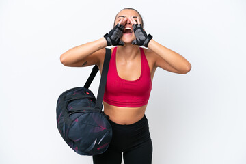 Poster - Young sport woman with sport bag isolated on white background shouting and announcing something