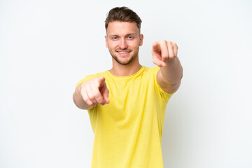 Wall Mural - Young blonde caucasian man isolated on white background pointing front with happy expression