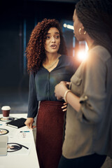 Wall Mural - Discussing the way forward. two businesswomen having a discussion at the office.