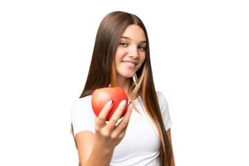 Sticker - Teenager caucasian girl holding an apple over isolated background with happy expression