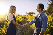 © Stratford/peopleimages.com - Partnering up to bring quality produce. a young man and woman shaking hands on a farm.