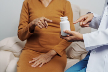 Elderly Asian female patients with cancer specialists meet by appointment to receive treatment advice for breast, cervical, lung cancer.