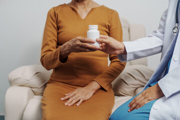 Elderly Asian female patients with cancer specialists meet by appointment to receive treatment advice for breast, cervical, lung cancer.