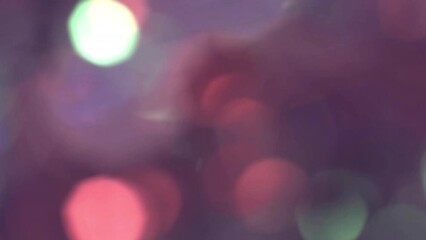 colorful bokeh of large circles on a pink background