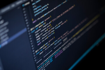 Software source code. Program code. Code on a computer screen. The developer is working on program codes in the office. Photo with source code.