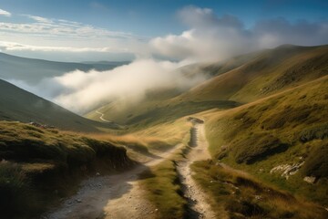 Wall Mural - dramatic mountain landscape, with misty clouds and blue sky above, viewed from a winding road, created with generative ai