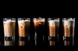 canvas print picture - line of iced coffee lattes on a black background, created with generative ai