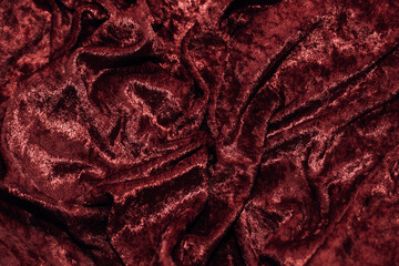 Wall Mural - Texture of red velor corduroy fabric with folds.