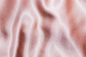 Wall Mural - Pink shiny texture of silk satin satin with folds.
