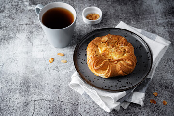 Wall Mural - Vanilla cream almonds sweet bun in a plate