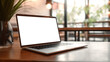 © Yeti Studio - Laptop computer mock-up with cut out screen in cafe. Copy space. Based on Generative AI