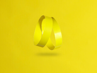 Wall Mural - Two yellow paper bracelets levitating on yellow background with a shadow