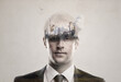Man, double exposure portrait and construction with city, ideas and mindset for urban development. Businessman, industry overlay and crane for production, building or manufacturing by gray background