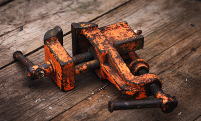 Wall Mural - Old vintage vise covered with orange paint