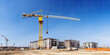construction site and yellow crane on the background blue sky, panoramic mock-up - Generative AI
