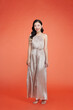 © makistock - asian lady in evening gown dancing on high heel shoes
