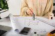 © sorapop - Architect interior design drawing with divider compass on house plan blueprint paper for editing on table desk at architecture office, Engineer sketching construction, Architectural project workplace