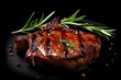 Grilled beef steak with rosemary and peppercorns on black background