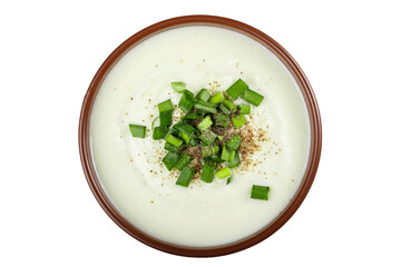 Wall Mural - Cauliflower cream soup in a clay plate isolated white background.