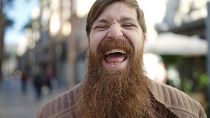 Canvas Print - Young redhead man smiling confident standing at street