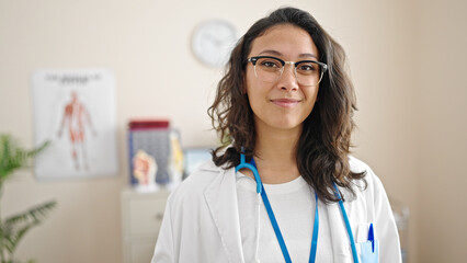 Sticker - Young beautiful hispanic woman doctor smiling confident standing at clinic