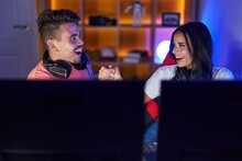 Man And Woman Streamer Playing Video Game Shake Hands At Gaming Room