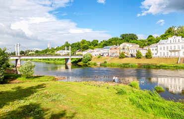 Canvas Print - Pedestrian bridge across the Tvertsa river in summer day