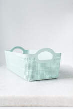 Pastel Green Organisation Basket With A White Background, Plastic Green Basket For Home Organisation, Pastel Green Basket With A Woven Pattern