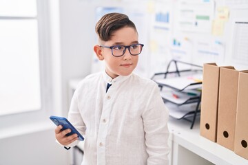 Sticker - Adorable hispanic boy business worker using smartphone at office