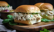  Two Chicken Salad Sandwiches On A Cutting Board With Lettuce.  Generative Ai